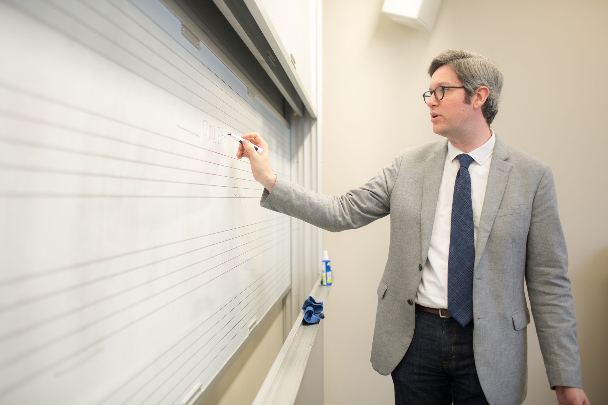 English professor Kraebel at the white board