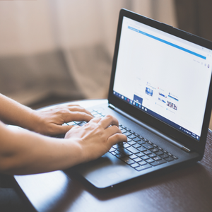 laptop and hands typing