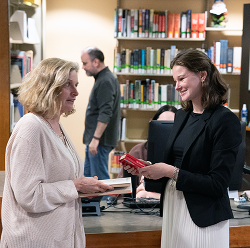 Erika and Ella working at the Service Desk in the Coates Library.
